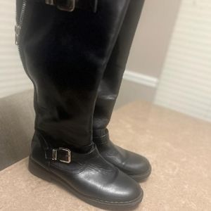 A black pair of JustFab knee boots